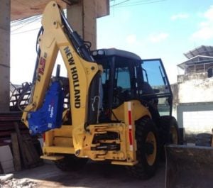 HydroRam HK45 Hydraulic Hammer on a New Holland Loader backhoe